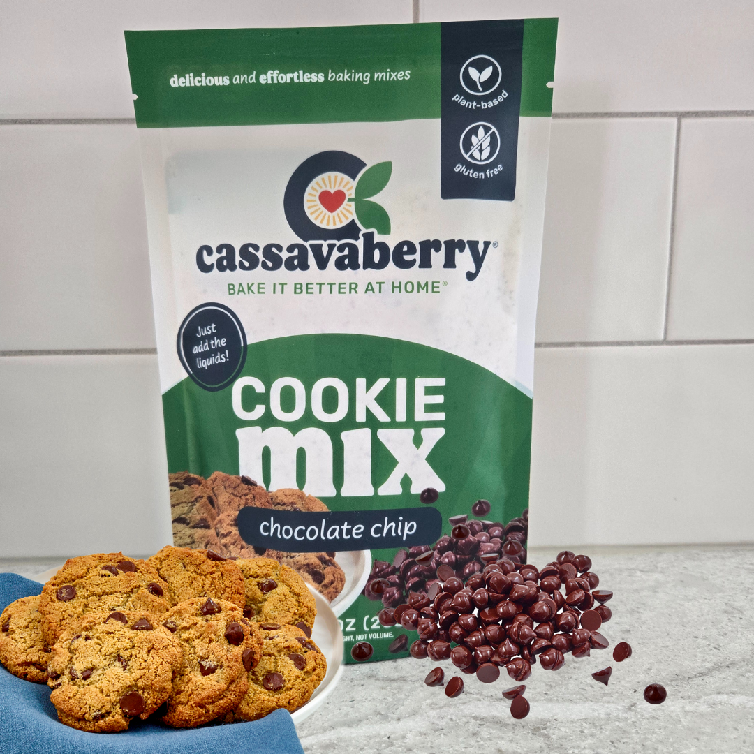 Gluten free, grain free and vegan Chocolate Chip Cookie Mix package with cookies on a plate and chocolate chips on the counter next to the package.