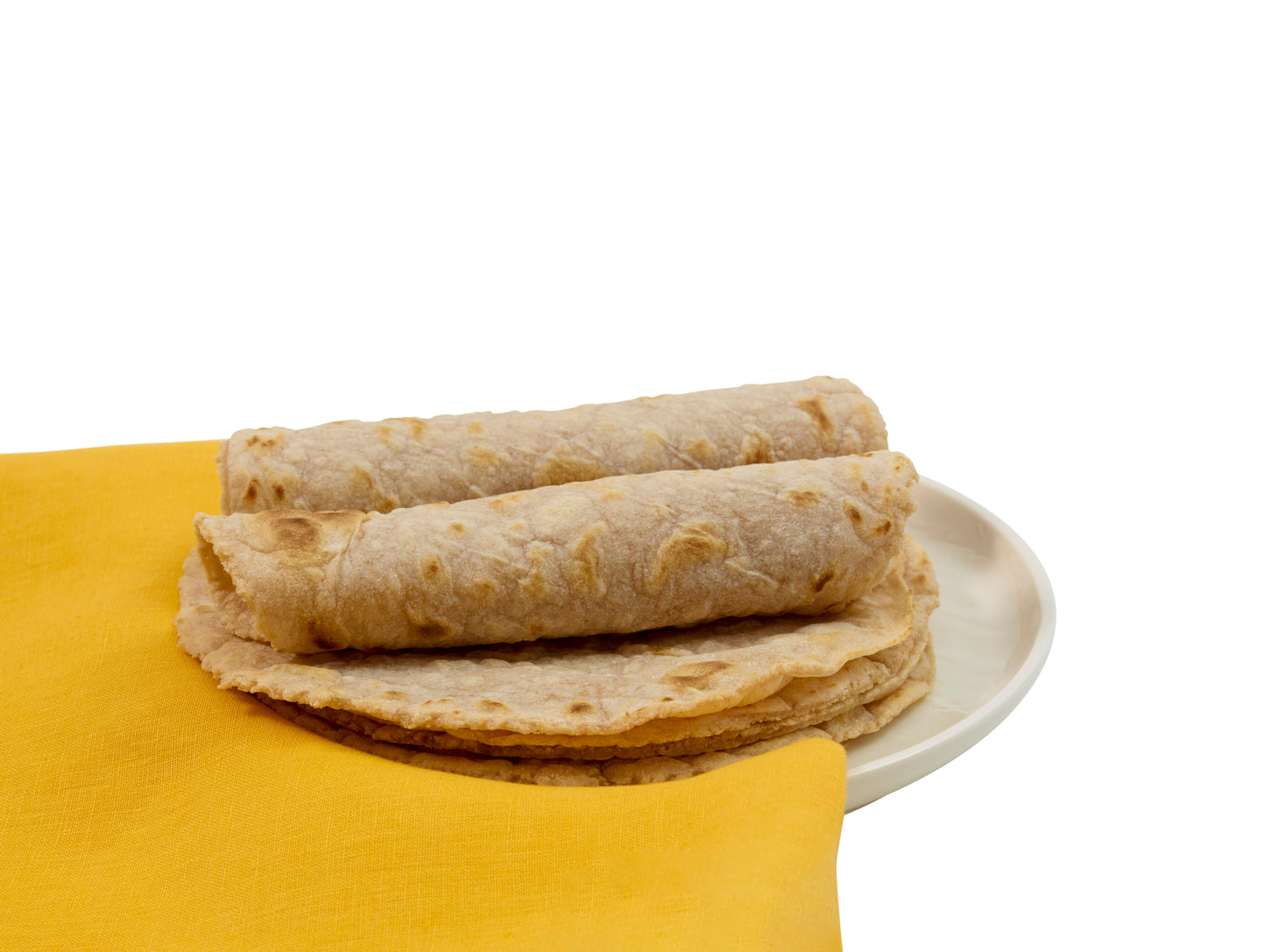 Rolled and flat tortillas on a white plate with a yellow cloth background