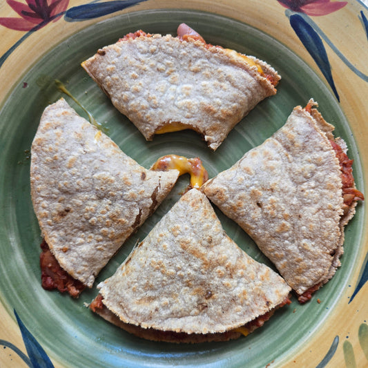 BBQ Quesadilla cut into four triangles