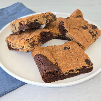 Cassavaberry Chocolate Chip Brookie bars on a white plate.