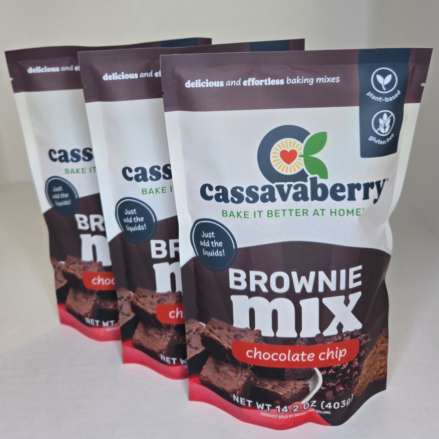 Three packages of Cassavaberry Brownie Mix on a white background