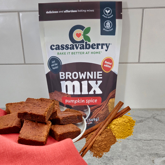 Cassavaberry Brownie Mix pumpkin spice packaging with brownies and spices on a kitchen counter.